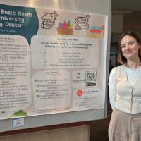 Toni Butler standing in front of her poster presentation